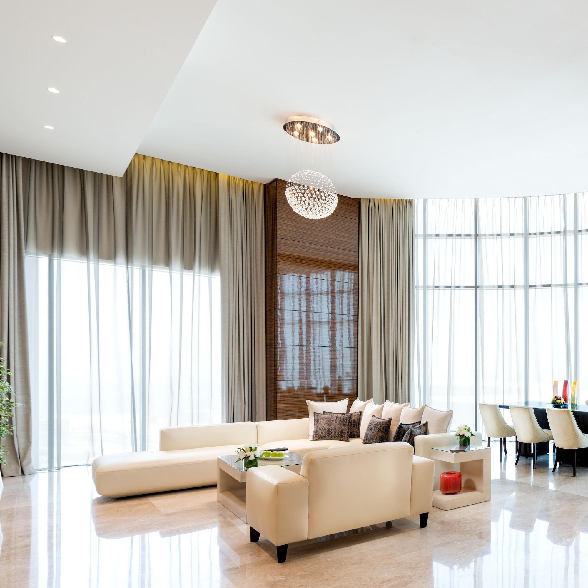 Fraser Suites Diplomatic Area Bahrain Manama Exterior foto A living room with curtains